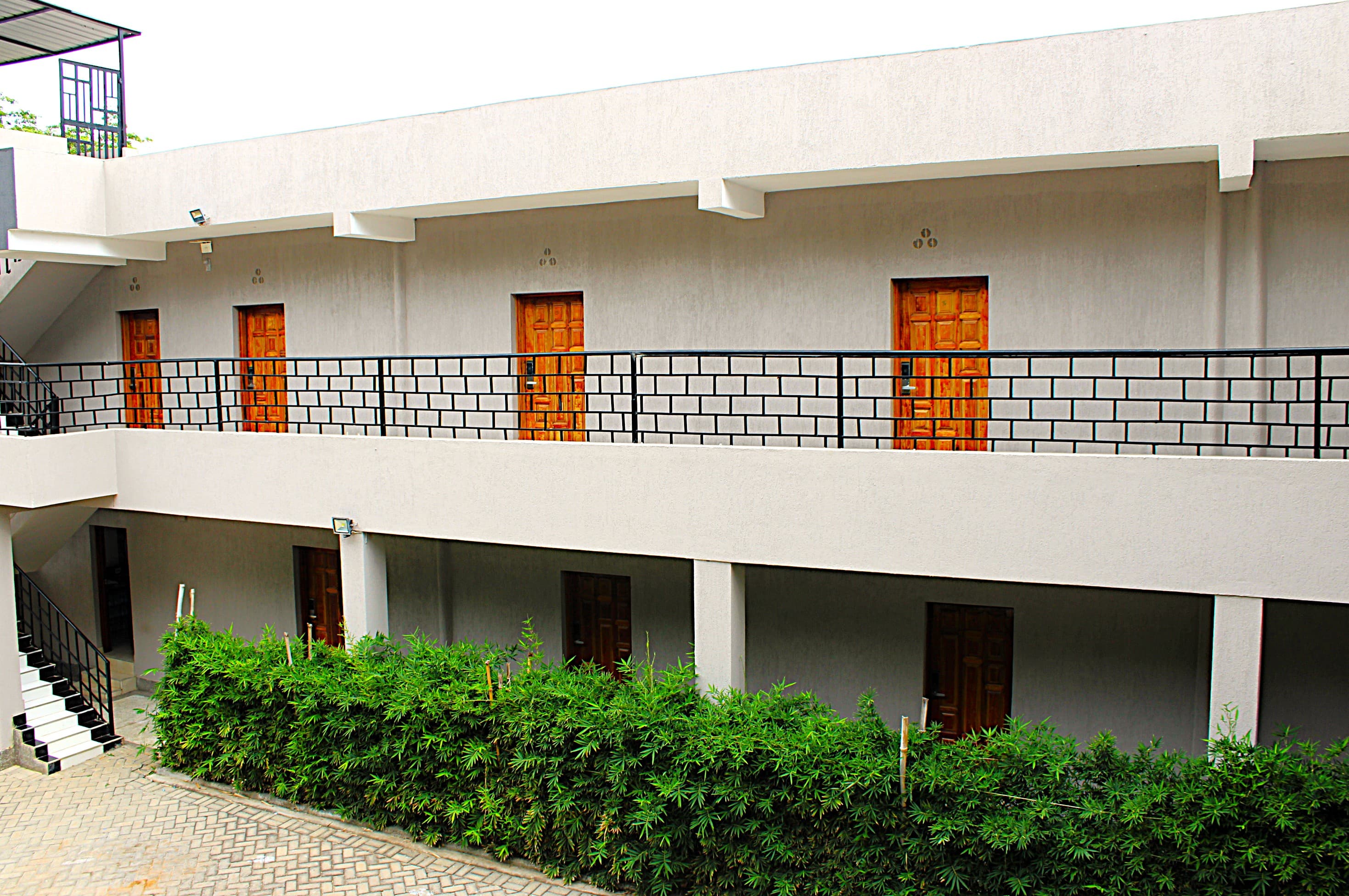 Guest room doors along the balcony at Shali Hotel