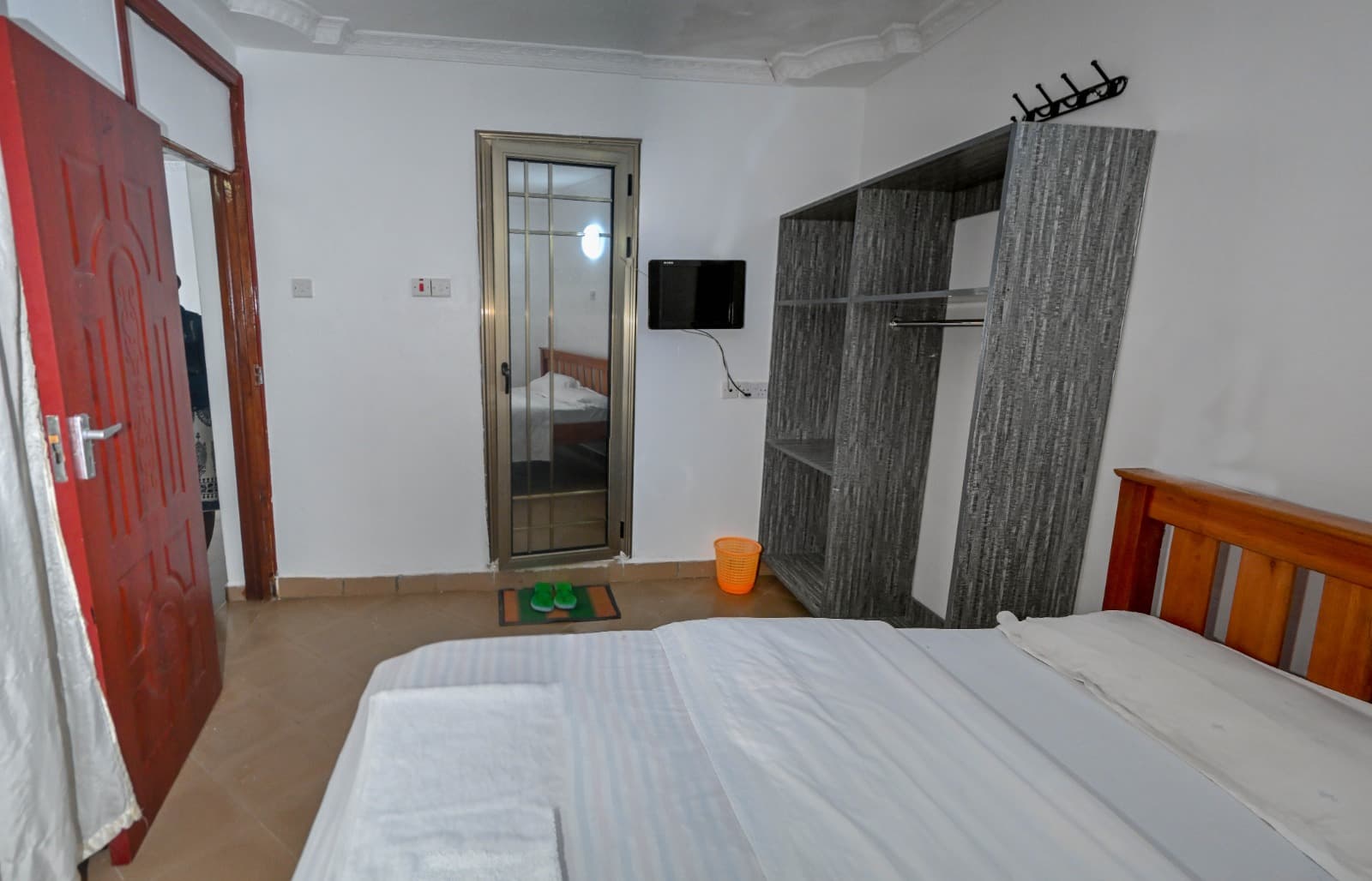Standard room — A study nook, wardrobe and television
